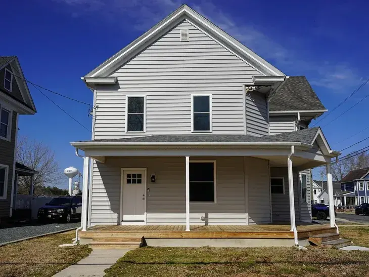 Restored Victorian home with new porch and siding
