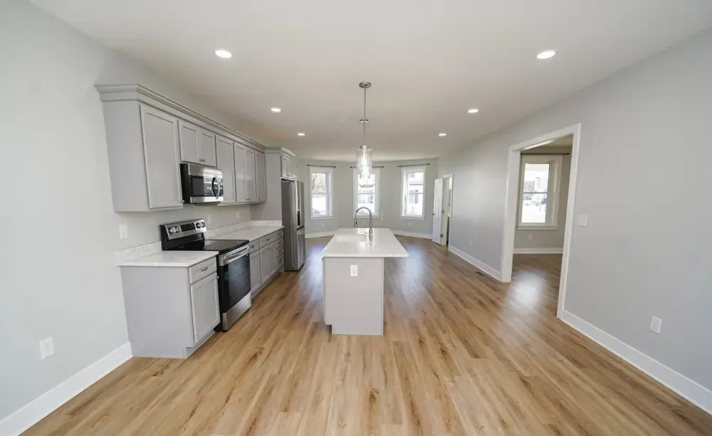 Open kitchen with island and gray shaker cabinets
