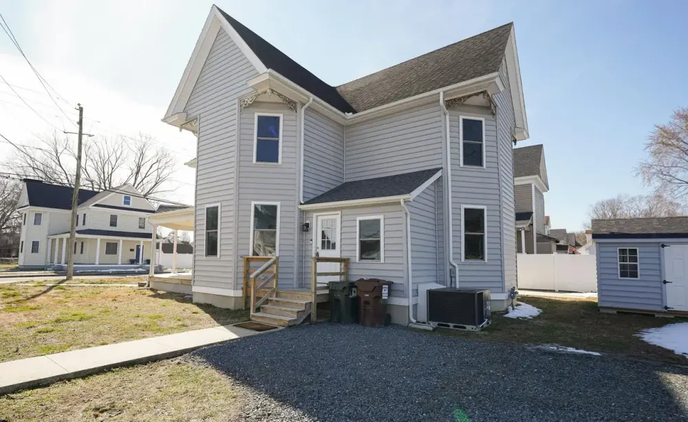 Rear of a home with new siding and trim