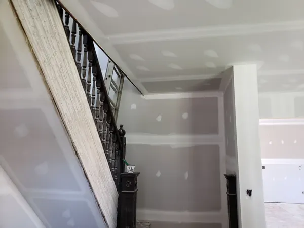 New drywall around the original staircase