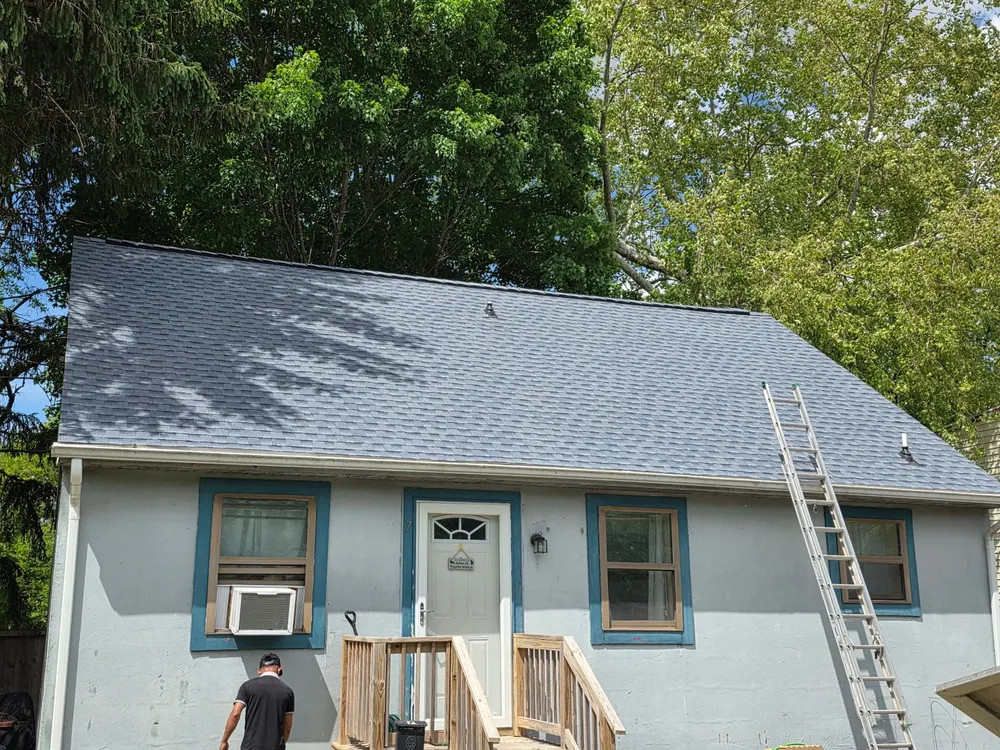 Freshly shingled roof on a Cape Cod home